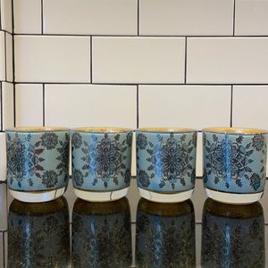 4 piece glass candle set.